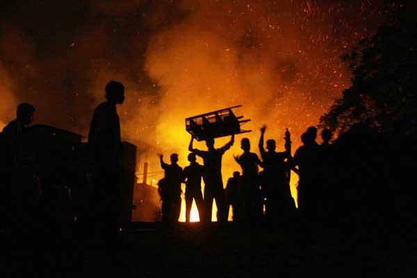 Up in flames....There's a devil in Kenya. The devil is hovering around and we have hugged him. (Photo Credit: techsahara)